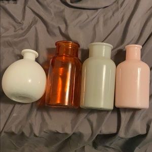 Four small glass vases